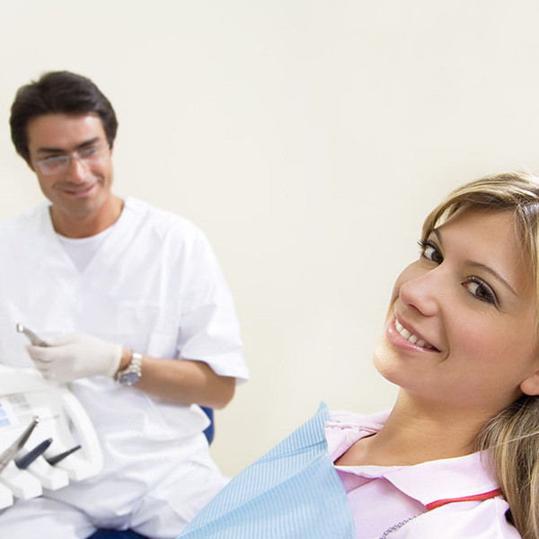 young lady smiling at dentist appointment