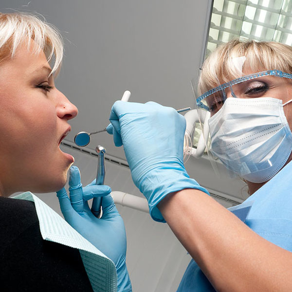 dentist checking patient