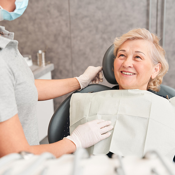 old patient getting teeth checked